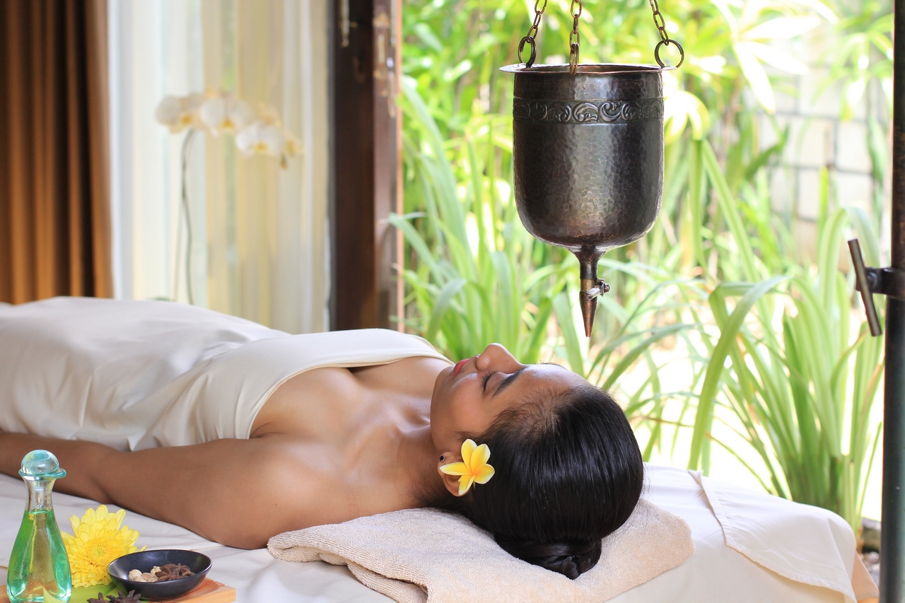 Traditional Shirodhara Ayurvedic treatment for deep relaxation